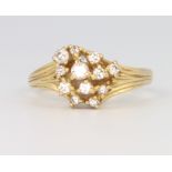 An 18ct yellow gold stylish diamond cluster ring, size P, 4.5 grams