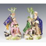 A pair of 19th Century Derby style figure groups of a lady and gentleman seated beneath a tree