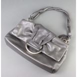 Christian Dior, a lady's grey soft leather handbag with silvered clasp marked Dior, and silver