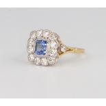 An 18ct yellow gold Art Deco style sapphire and diamond cluster ring, the centre stone approx. 0.