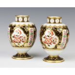 A pair of Wedgwood Imari pattern baluster vases decorated with flowers 14cm