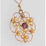 An Edwardian 9ct yellow gold garnet pendant and chain 2.8 grams