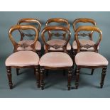 A set of 6 Victorian style mahogany balloon back dining chairs with pierced mid rails and over