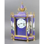 A reproduction French 19th Century 8 day striking mantel clock with enamelled dial and Roman
