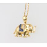 An 18ct yellow gold sapphire and diamond elephant pendant on a 40cm chain, 3.6 grams