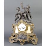 A French 19th Century 8 day striking mantel clock with enamelled dial contained in a spelter case