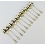 Eleven 800 standard silver gilt fancy teaspoons 85 grams