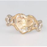 A 9ct yellow gold diamond set heart shaped ring size U, 3.1 grams
