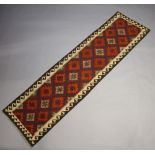 A red, blue and tan ground Maimana Kilim runner with all over geometric design 300cm x 79cm