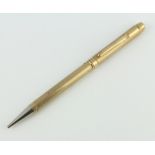 A 9ct yellow gold engine turned propelling pencil