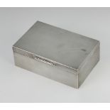 A rectangular silver engine turned cigarette box Birmingham 1955 13.5cm