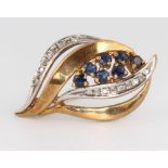 A 9ct yellow gold sapphire and diamond scroll brooch, 30mm
