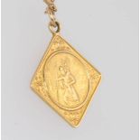 A 9ct yellow gold St Christopher pendant and chain 4.3 grams