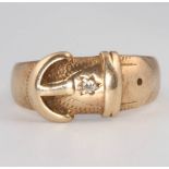 A 9ct yellow gold diamond set buckle ring size T, 5.8 grams