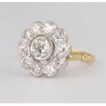 An 18ct yellow gold diamond daisy cluster ring, approx. 1.75ct size P 1/2