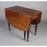 A Victorian mahogany drop flap gateleg dining table fitted 2 frieze drawers raised on turned and