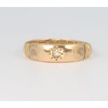 A 15ct yellow gold diamond ring, size Q, 2 grams