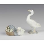 A Lladro figure of a goose and a basket of goslings 6cm together with a figure of a goose 12cm