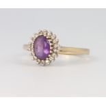 A 9ct yellow gold amethyst and diamond cluster ring size M, 2.7 grams