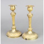 A pair of 18th Century style gilt metal candlesticks with detachable sconces converted for use as
