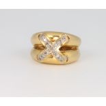 An 18ct yellow gold diamond set cross ring, size J, 10.4 grams