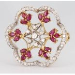 A yellow gold ruby and diamond floral open brooch, 32mm