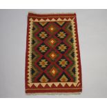 A green, terracotta and black ground Maimana Kilim 96cm x 60cm