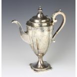 A 19th Century silver coffee pot chased with swags, festoons and a vacant cartouche, with S scroll