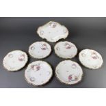 A Limoges part dessert service comprising 6 plates and a shaped dish