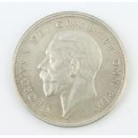 A George V proof crown 1928, modified bare head, the reverse with crown and date in wreath