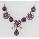 A silver gilt Edwardian style cabochon amethyst, seed pearl and diamond necklace