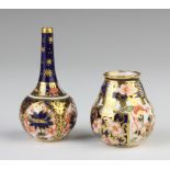 A Royal Crown Derby Imari pattern vase 6cm, a baluster ditto 3.5cm and a pitcher 5cm The last item