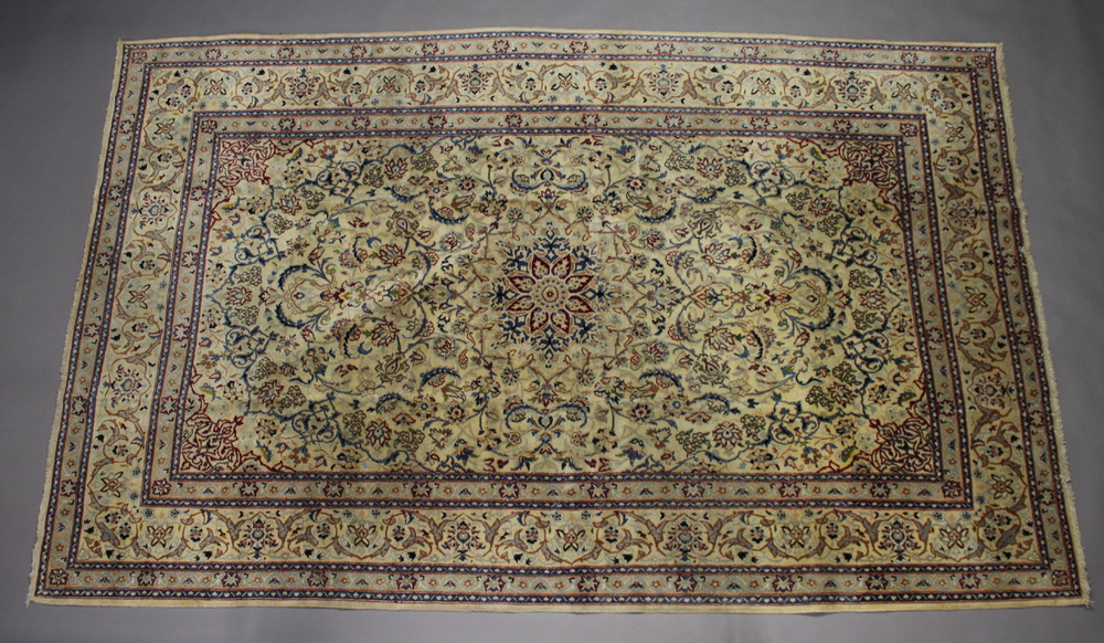A blue and white ground Nain carpet with central medallion 322cm x 201cm This rug has a strong aroma