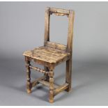 A 17th/18th Century bleached oak bar back hall chair with solid seat, raised on turned and block