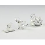 A Swarovski figure of a swan 5.5cm, a moth 5cm and a bear on a sledge 3.5cm