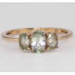 A 9ct yellow gold 3 stone gem set ring, size O 1/2, 1.8 grams