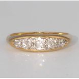An 18ct yellow gold 5 stone diamond ring, size O