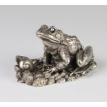 A filled silver model of a frog and snail 10cm