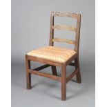 A George III mahogany London ladder back chair with upholstered drop in seat, raised on square