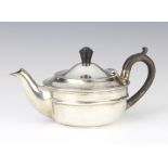 A silver breakfast teapot with ebony mounts London 1918, gross 310 grams