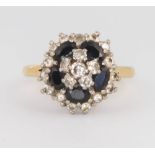 An 18ct yellow gold sapphire and diamond cluster ring, size P, 7.8 grams