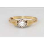 An 18ct yellow gold single stone diamond ring, size P, 3.6 grams