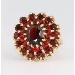 A 9ct yellow gold garnet cluster ring, size N, 6.4 grams