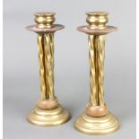 A pair of 19th/20th Century brass and brown bakelite candlesticks 26cm h x 9cm