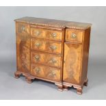 A crossbanded mahogany Chippendale style breakfront sideboard fitted a brushing slide above 4 long