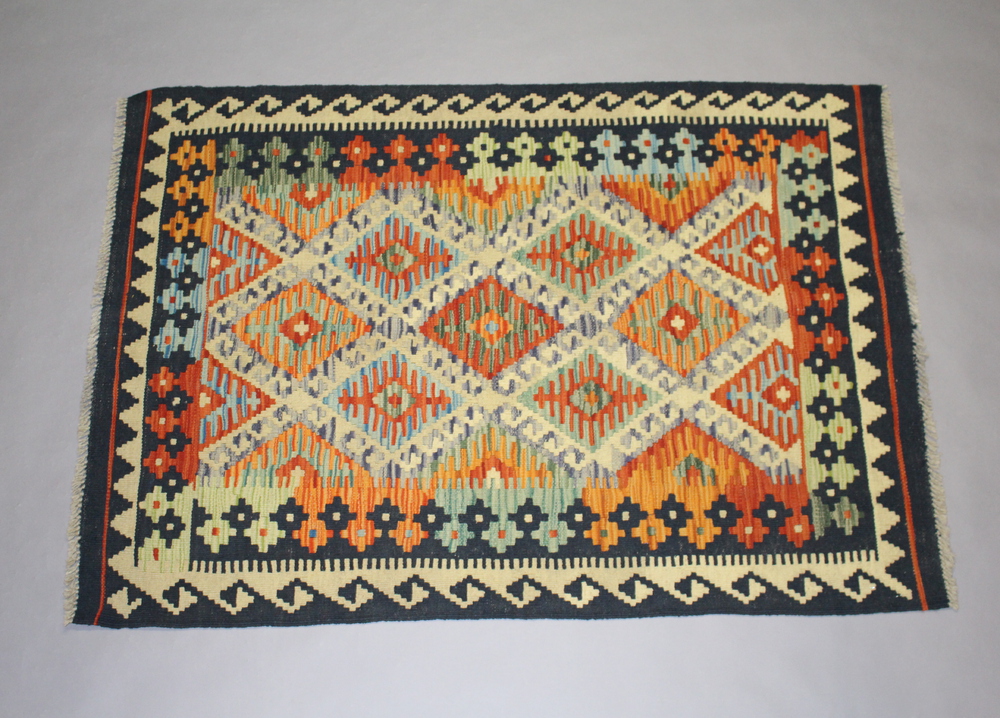 A black, white, tan and turquoise ground wood Chobi Kilim 140cm x 100cm