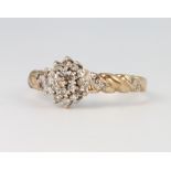 A 9ct yellow gold diamond cluster ring size P, 2.4 grams