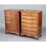 A pair of Georgian style mahogany crossbanded chests of serpentine outline, fitted 6 drawers with