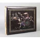 A 19th/20th Century Japanese lacquered photograph album, the cover decorated a rickshaw together