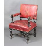 A Victorian ebonised open arm chair, the red leather seat with earl's coronet and monogrammed R,